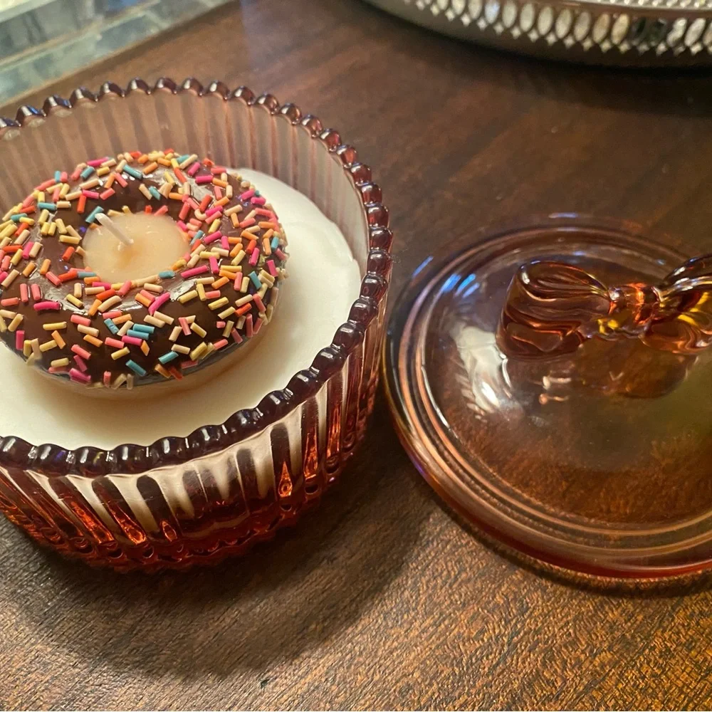 Adorable Donut Sprinkle Soy Candle in pink bow lidded glass jar. Donut scent